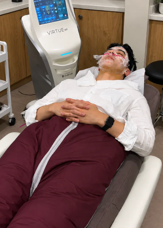 A client resting in the Slimyonik air suit during a session at the Mayfair clinic