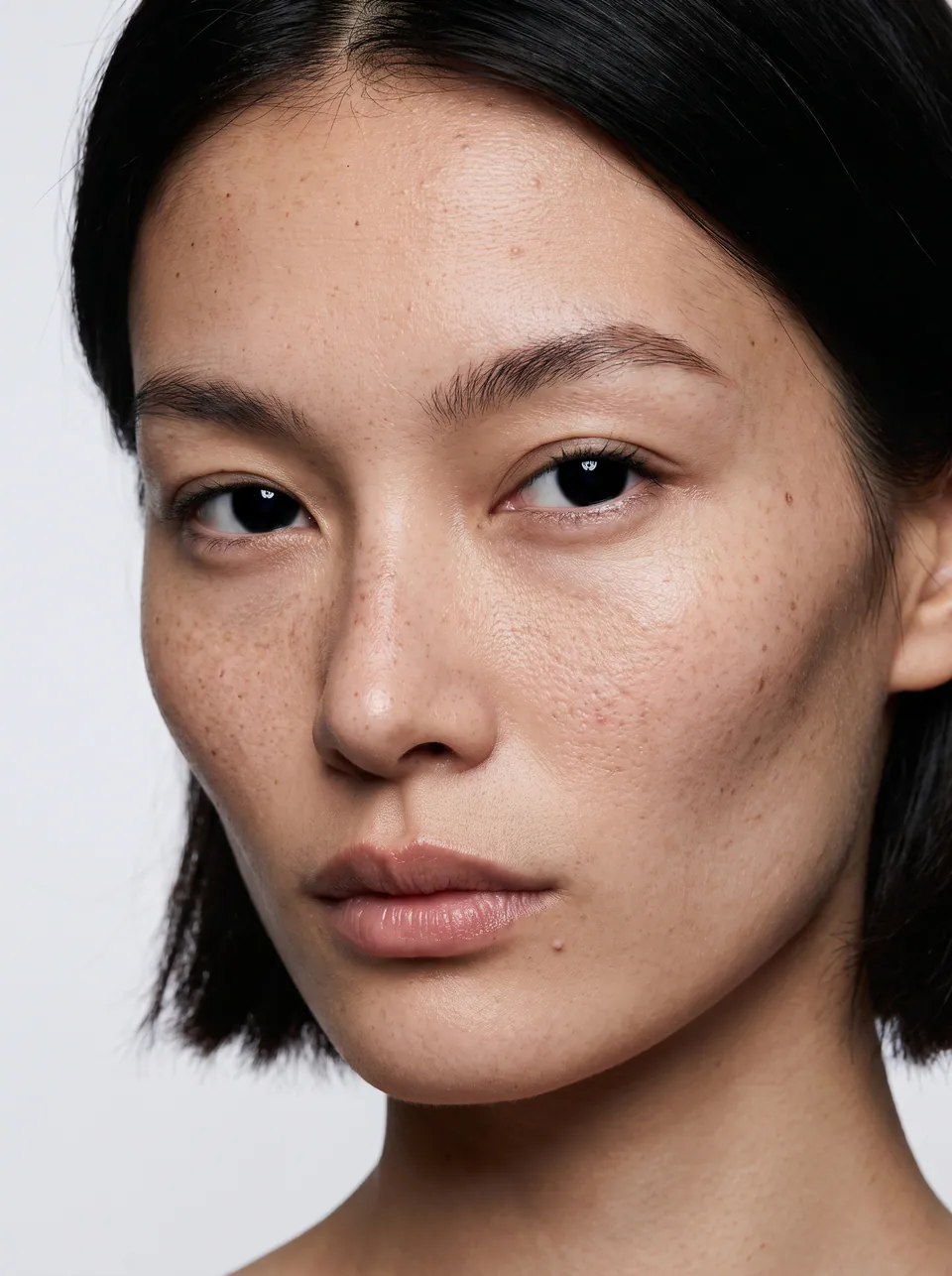 Close portrait of a woman showing defined cheekbones and jawline