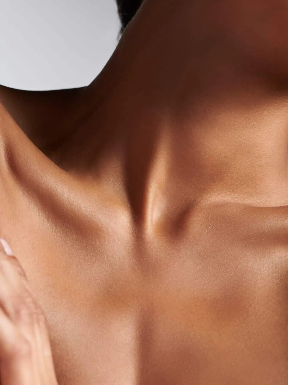 Close-up of a woman’s neck and collarbone