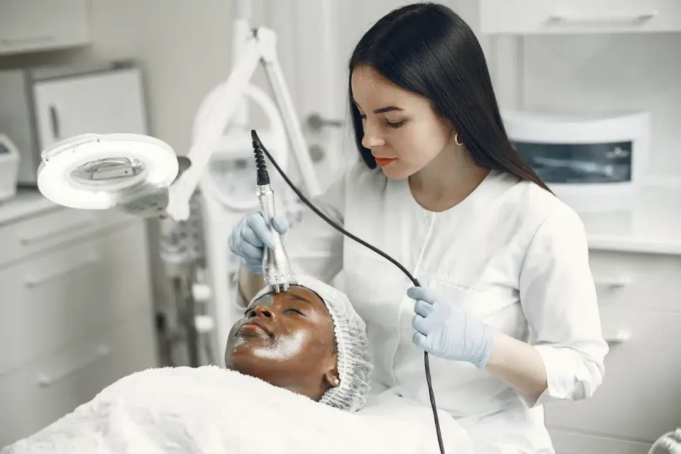 Dermatologist treating patient