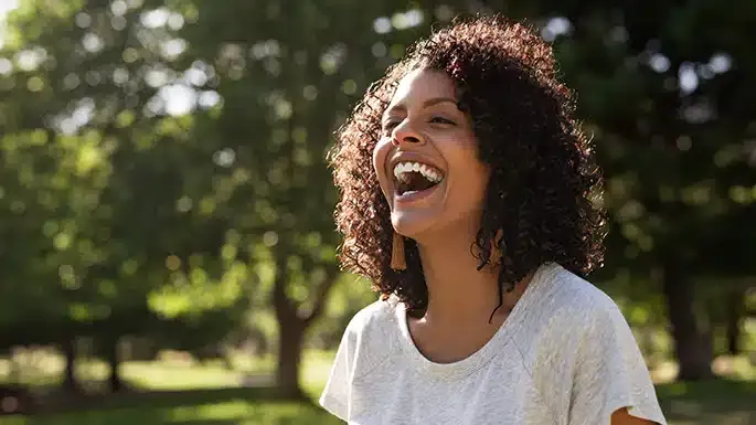 smiling woman with radinat skin