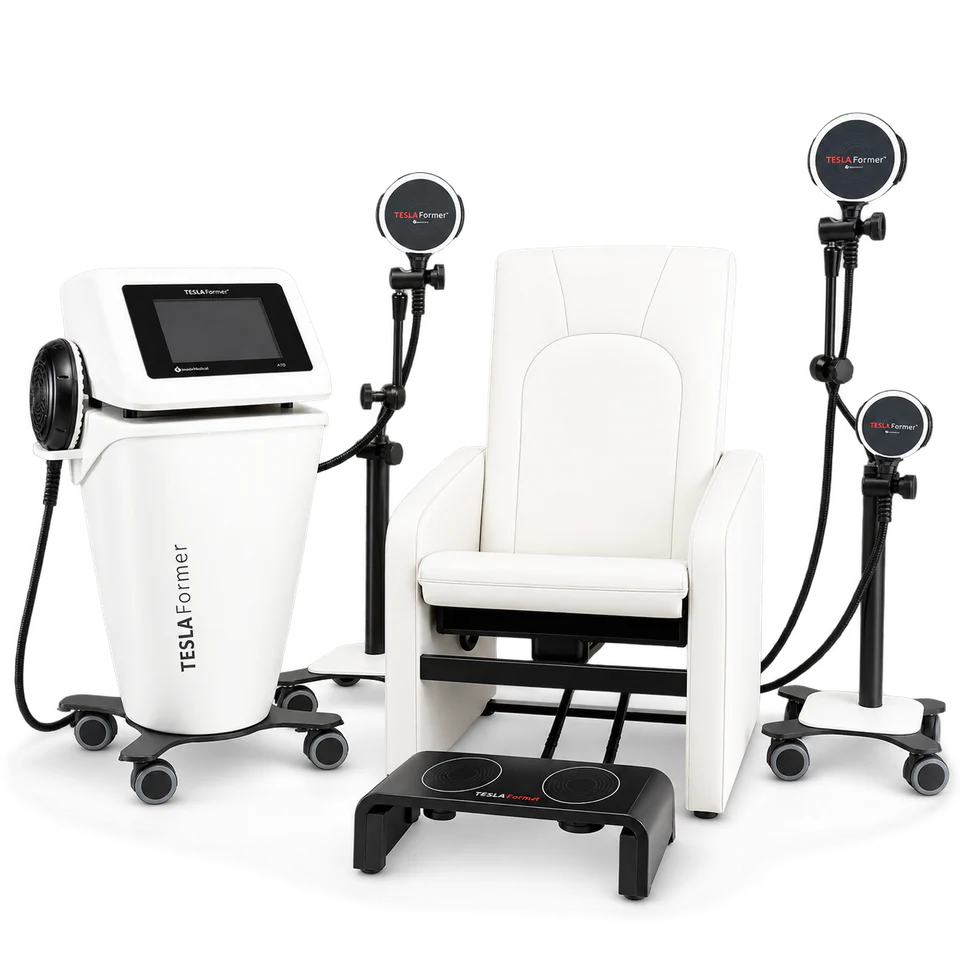 The Tesla Former console with applicator arms alongside the Tesla Chair