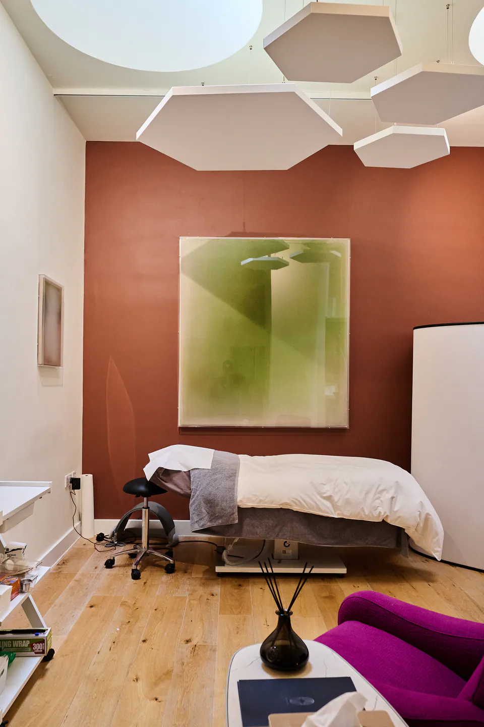 Treatment room with terracotta wall and daylight ceiling