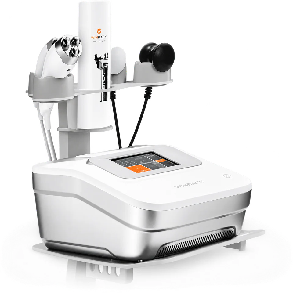 The Winback Tecar Therapy device, with touchscreen console and three handpieces on its stand