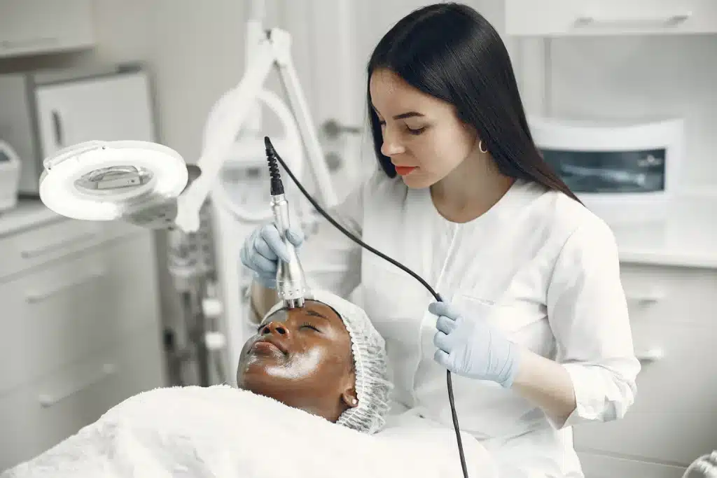 Dermatologist treating patient